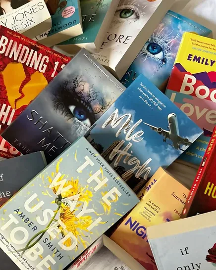 An open novel resting on a desk